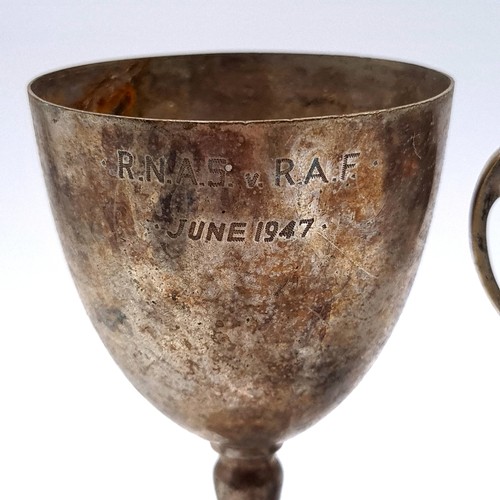 440 - A collection of four items, consisting of two metal inscribed vintage metal presentation trophies, t... 