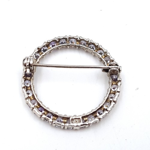 446 - A pretty example of a Sterling Silver wreath gem stone brooch, with original pin intact.