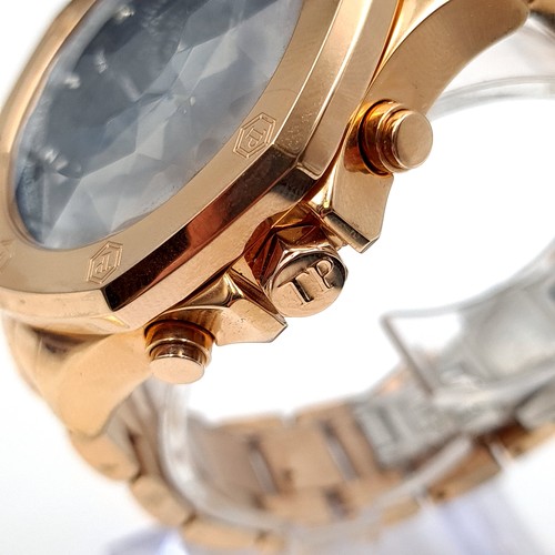 463 - A very heavy example of a Tresor 18 carat chronograph rose gold plated wrist watch, with stylish bla... 