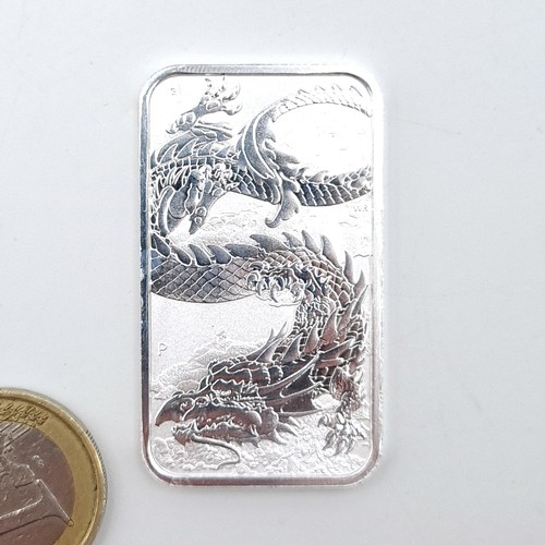 473 - A mounted sterling silver ingot, dated 2023. Weight: 31.33 grams. 0.9999 pure