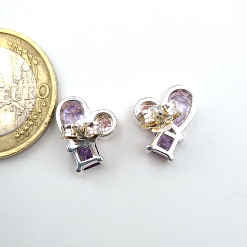 489 - A very pretty pair of sterling silver Amethyst and Tourmaline stone stud earrings. Old, new stock. N... 