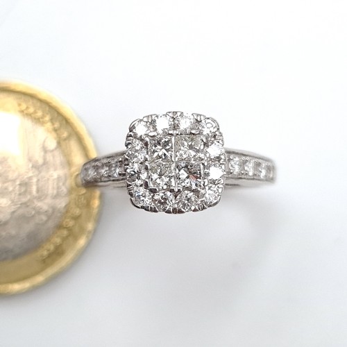 496 - Super Star Lot: An exquisite 9 carat White Gold Diamond cluster ring, featuring a square form which ... 