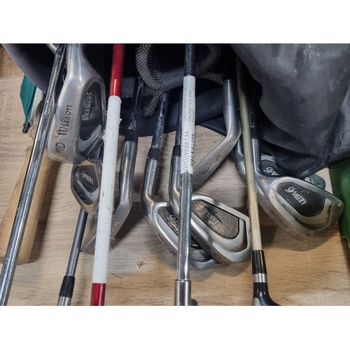 1050 - A very Good set of Clubs by Wilson Ultra 45 irons 3,4,5,6,7,9 PW  And a Wilson Staff putter and Tayl... 