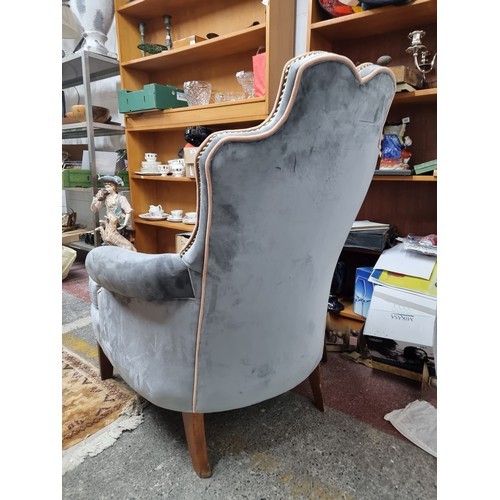 995 - Star Lot : A fabulous handsome vintage button back arm chair with a grey plush upholstery and blush ... 