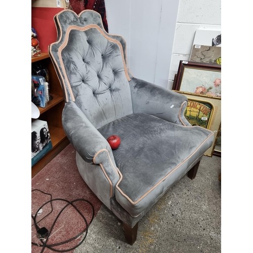 995 - Star Lot : A fabulous handsome vintage button back arm chair with a grey plush upholstery and blush ... 