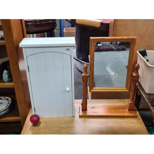 856 - Two bathroom items including a cabinet and a pine vanity mirror.