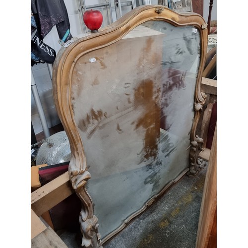 Star Lot A very large early century Irish over mantle mirror held in
