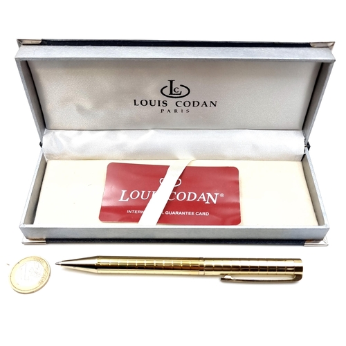 12 - A Louis Codan of Paris ballpoint pen with a gold toned body. Encased in original box.