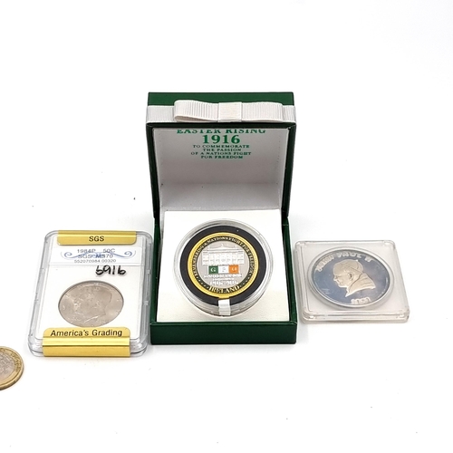 17 - A collection of 3 coins consisting of an Easter Rising medallion circa 1916-2016 in original display... 