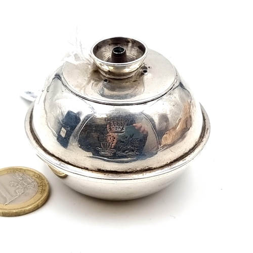 24 - A small sterling silver oil lamp, hallmarked London 1877, maker Martin Hall. 7cm in diameter. Weight... 
