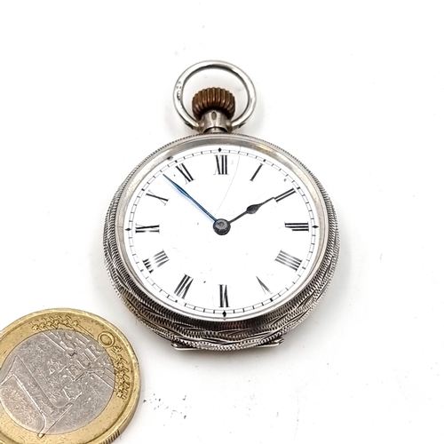 30 - A pretty sterling silver Fob Watch no. 33406, set with white enamel dial with roman numeral figures.... 