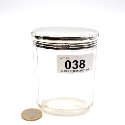 38 - A sterling silver Lidded Glass Dressing Table Jar, hallmarked London, maker John Pound & Co. Dims - ... 