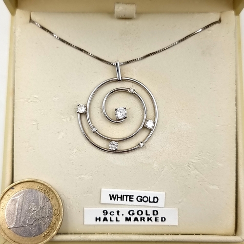 59 - A 9ct White Gold Pendant and Chain set with Gemstone accents. Total weight 4.68 gms.