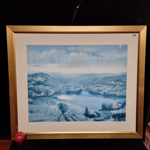 88 - A very large print of a rolling landscape painting. With a blued Hue. In a large good quality frame ... 