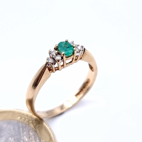 888 - Star Lot : A fabulous example of a vintage Emerald and Diamond 9 carat gold ring, this example featu... 