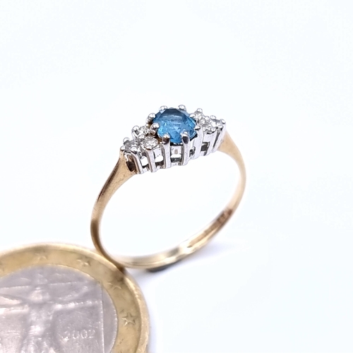 892 - Star Lot : A fabulous example of a Diamond and Blue Topaz 9 carat gold ring, set with a marquis sett... 