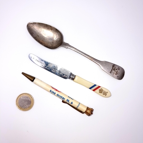 908 - A collection of three interesting items, including a Georgian Irish silver fiddle pattern tea spoon.... 