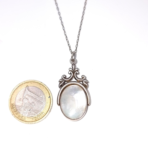 913 - A beautiful example of a finely crafted dual sided sterling silver pendant necklace, featuring an On... 