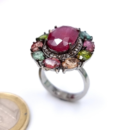 916 - Star Lot : A fabulous large natural Ruby Ring of 5carats with a multi stone surround of Topaz, tourm... 