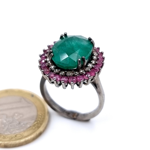 919 - Star Lot : A Beautiful natural  Emerald stone Ring of 6.35 cts with a Ruby and Diamond surround moun... 