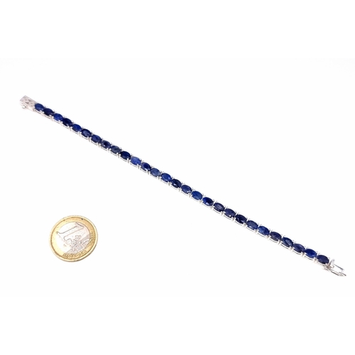 923 - Star Lot : A Stunning in line natural Sapphire Line Bracelet, length 19cm. With fabulous 28 matched ... 