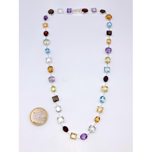 926 - Star Lot : A stunning Multi Stone Necklace of natural Amethyst, Citrine, Garnet, Topaz and Peridot s... 