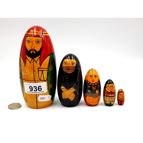 936 - A hand painted Matryoshka doll containing five hand painted dolls.