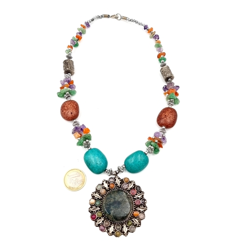 941 - A highly ornate Beaded Necklace with a large pendant. Featuring amethyst, amber and turquoise gemsto... 