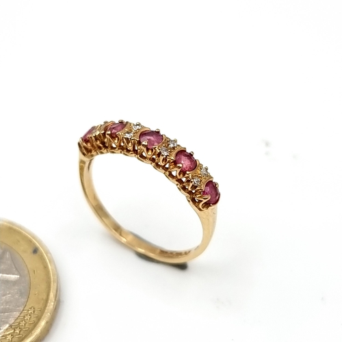 945 - Star Lot : A stunning 9ct Gold Ring set with diamonds and spinel gemstones. Weight 1.45g. Size L. Wi... 