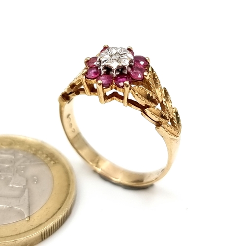 949 - Star Lot : A stunning 9ct Gold Ring with a gorgeous floral design set with diamonds and featuring a ... 