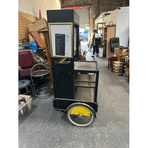 515 - Star Lot : A two wheel  mobile cocktail stand.  Includes slots for glasses.  An unusual item that co... 