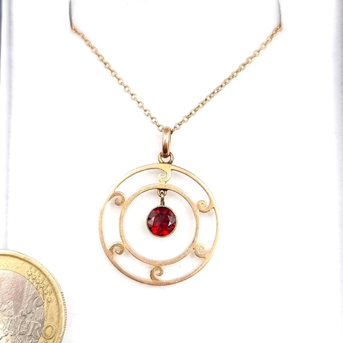 951 - Star Lot : A wonderful 9ct Gold Necklace featuring an unusual pendant with a hanging stone in a red ... 