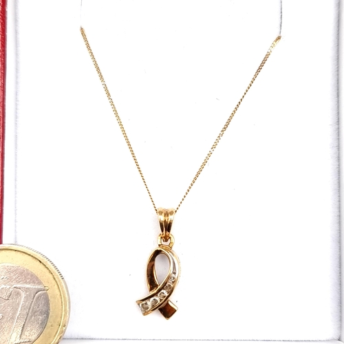 952 - An elegant 9ct Gold Necklace with a diamond set Pendant in the form of a cancer ribbon. Weight 2.04g... 