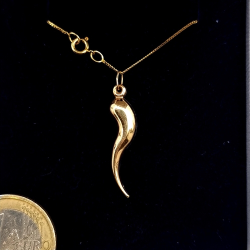 953 - An unusual 9ct Gold Necklace with an abstract pendant. Both with hallmarks. Weight 1.25g. With prese... 