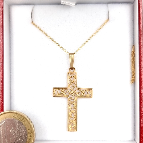 959 - A wonderful 9ct Gold Necklace with a crucifix pendant boasting foliate motifs. Both feature 375 hall... 