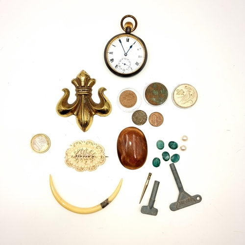 969 - An assortment of items including a five facet cut jade stones, a Swiss made fob watch, a heavy brass... 