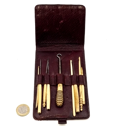 972 - A wonderful antique sewing kit complete with bone handled tatting tools, housed in a smart leather t... 