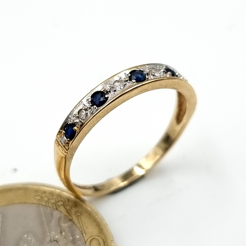 981 - Star Lot : A lovely 9 stone Sapphire and Diamond Ring, size N, weight 1.48 gms.