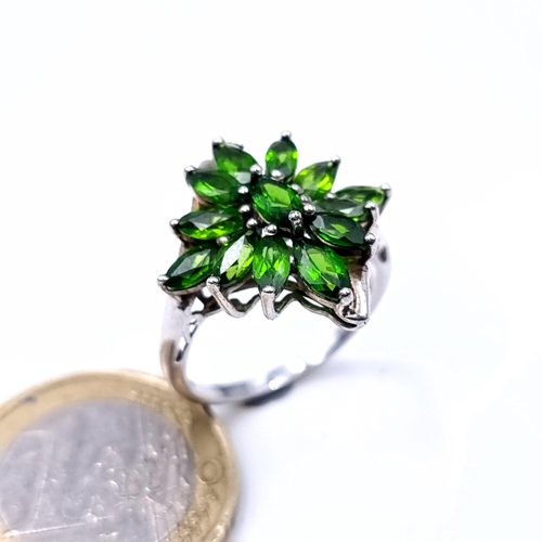 985 - A fine Diopsite Sterling Silver Ring set with a central mounted stone together with a 12 stone clust... 