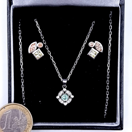 987 - A Sterling Silver Spinel Stone Pendant with White Sapphire surrounds, length of chain 46cm, together... 