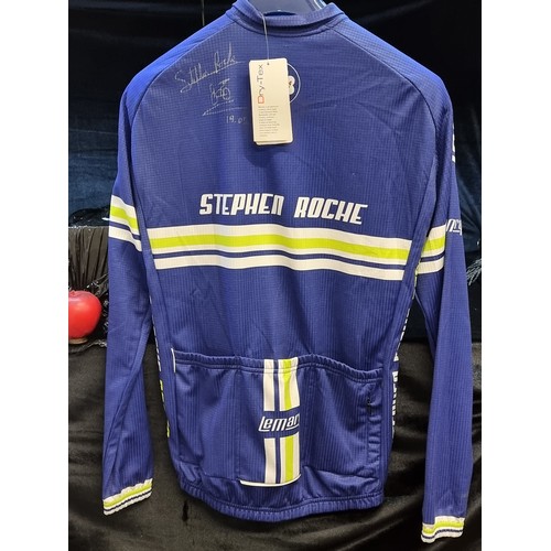 975 - Star Lot: A cycling jersey signed to back by Stephen Roche, the Irish former professional road racin... 