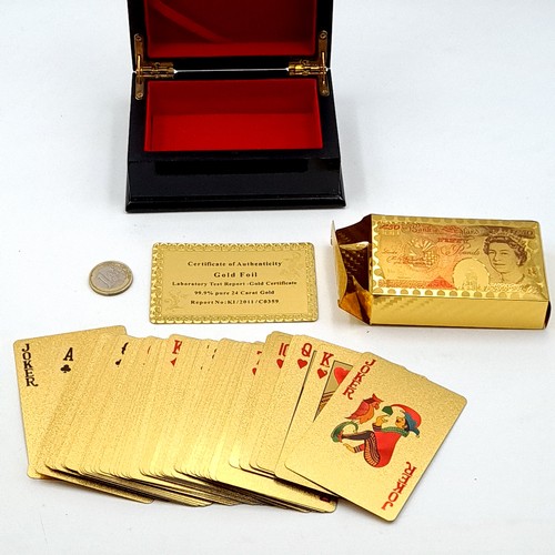 22 - A collection of 24ct gold foil plated Playing Cards in unused condition depicting a UK 50 pound note... 