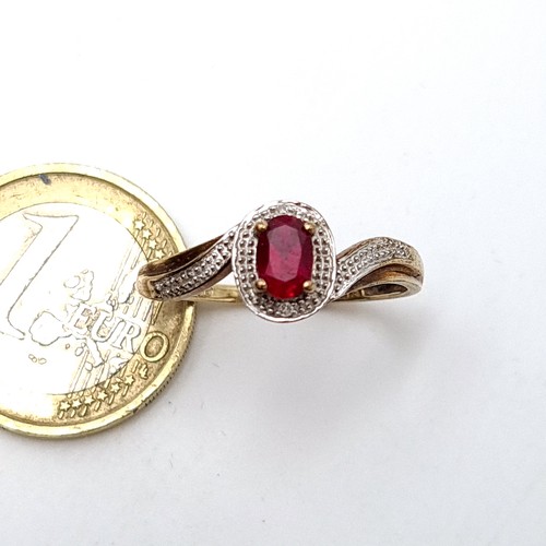 46 - Star Lot : A beautiful Ruby and Diamond Ring, diamond stamped to band set on a twist 9ct gold settin... 