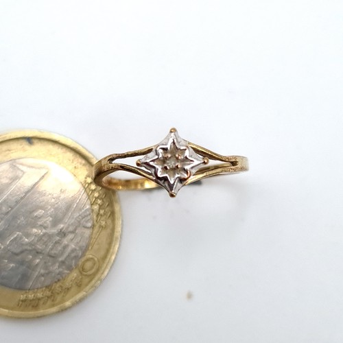 53 - A 9ct Gold Illusion Set Star Diamond Ring. Size H, weight 1.13 gms.