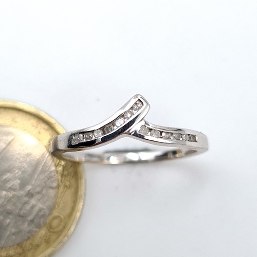 54 - Star Lot : An attractive Twist Set 9ct White Gold Diamond Ring, diamond stamped to band, size K 1/2,... 