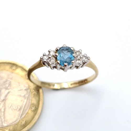 892 - Star Lot : A fabulous example of a Diamond and Blue Topaz 9 carat gold ring, set with a marquis sett... 