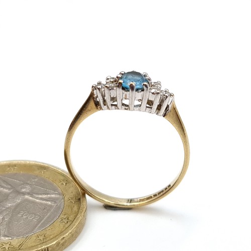 892 - Star Lot : A fabulous example of a Diamond and Blue Topaz 9 carat gold ring, set with a marquis sett... 