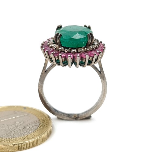 919 - Star Lot : A Beautiful natural  Emerald stone Ring of 6.35 cts with a Ruby and Diamond surround moun... 