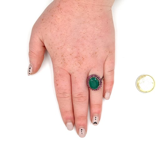 919 - Star Lot : A Beautiful natural  Emerald stone Ring of 6.35 cts with a Ruby and Diamond surround moun... 