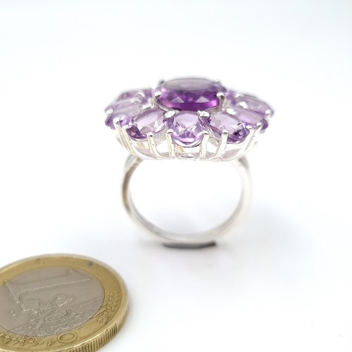 927 - A stunning very large Amethyst gemstone Ring with Amethyst cluster surround and mounted in sterling ... 